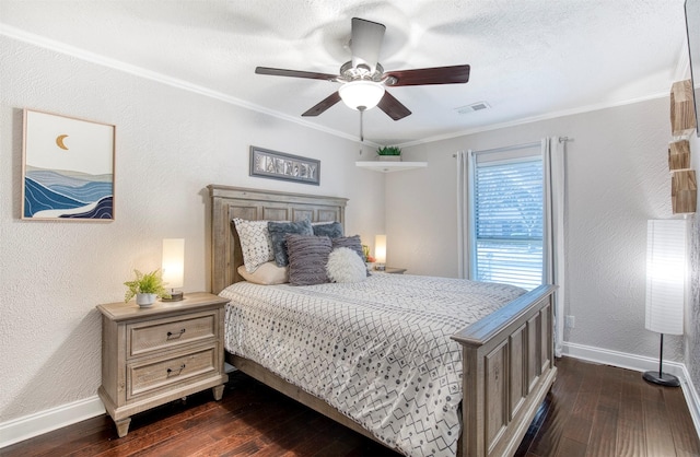 bedroom featuring ornamental molding, dark hardwood / wood-style floors, and ceiling fan