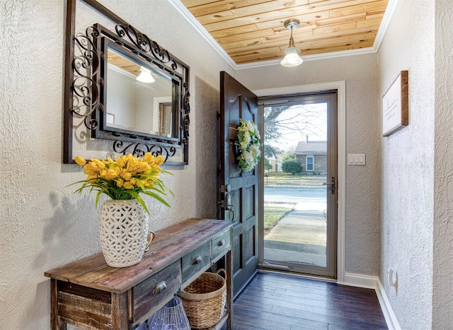 foyer with ornamental molding, dark hardwood / wood-style flooring, and wooden ceiling