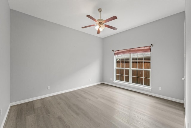 unfurnished room featuring light hardwood / wood-style flooring and ceiling fan