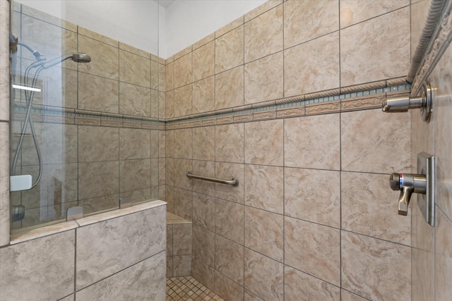 bathroom featuring tiled shower