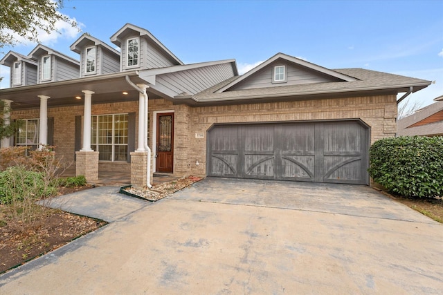 view of front of house featuring a garage and covered porch