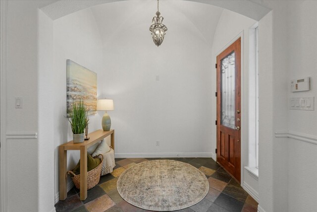 foyer entrance with lofted ceiling