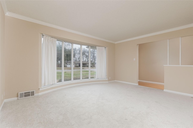 carpeted spare room with ornamental molding