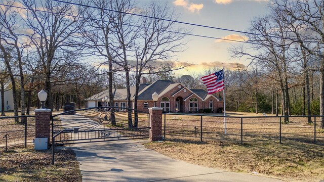 view of front of property with a lawn