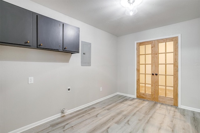 laundry area featuring cabinets, hookup for an electric dryer, electric panel, and light hardwood / wood-style floors