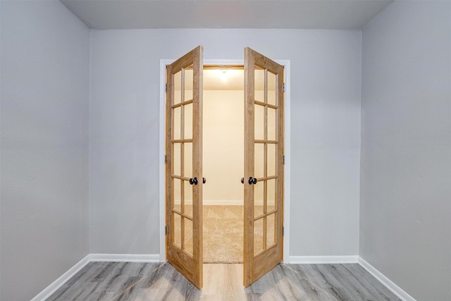 empty room with light hardwood / wood-style flooring