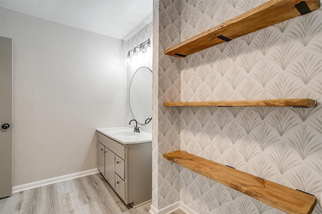 bathroom with vanity and hardwood / wood-style floors