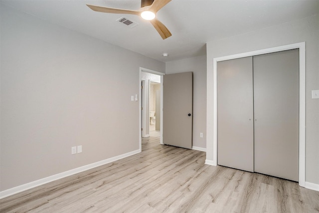 unfurnished bedroom with a closet, ceiling fan, and light hardwood / wood-style flooring