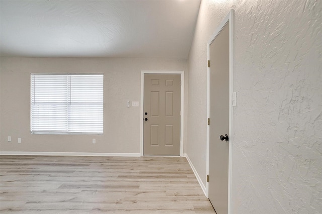 entryway with light hardwood / wood-style floors