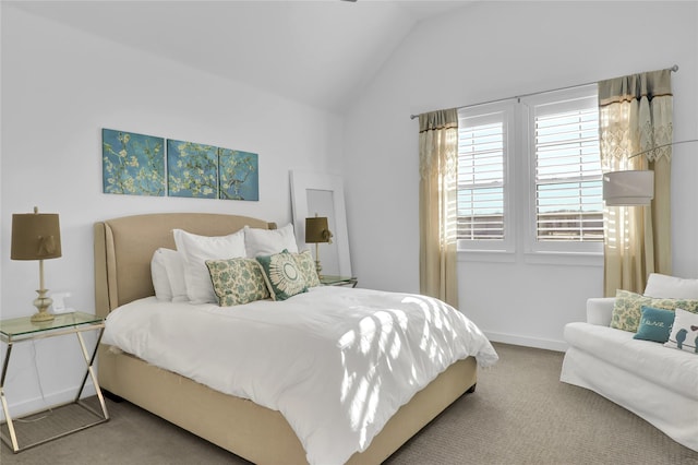 carpeted bedroom with lofted ceiling