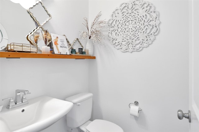 bathroom featuring sink and toilet