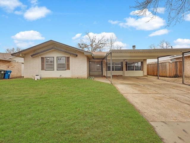 ranch-style home with a carport and a front yard