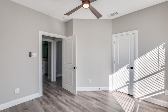 unfurnished room featuring ceiling fan and light wood-type flooring