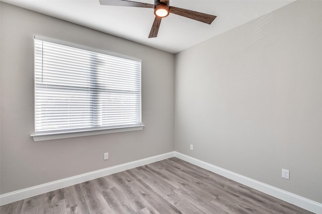 spare room featuring ceiling fan and light wood-type flooring