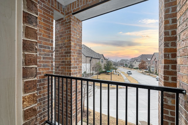 view of balcony at dusk