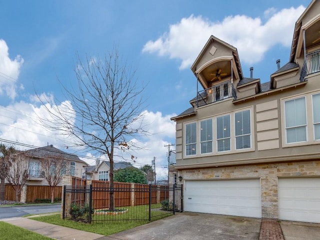 view of home's exterior with a yard, a garage, and a balcony