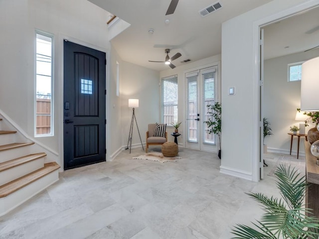 foyer featuring ceiling fan and plenty of natural light