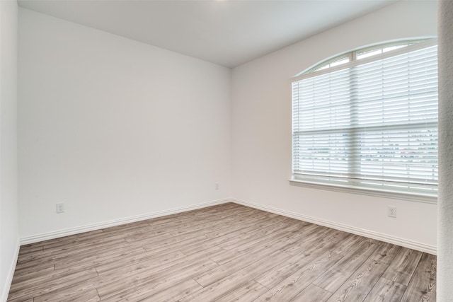 spare room with light wood-type flooring