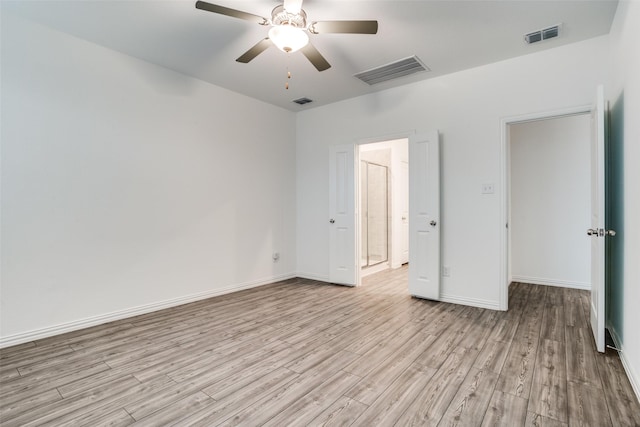 unfurnished bedroom with ceiling fan and light hardwood / wood-style floors