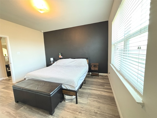 bedroom featuring wood-type flooring