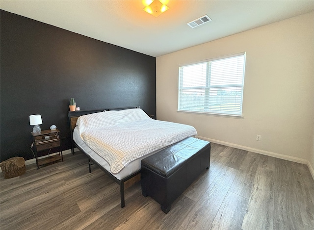 bedroom featuring dark wood-type flooring