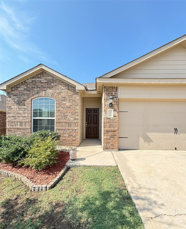 view of exterior entry featuring a garage