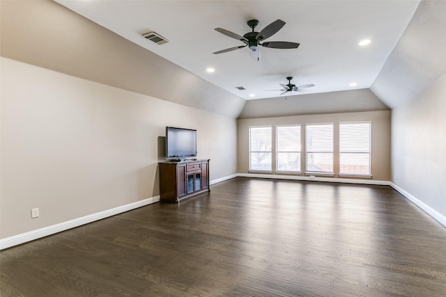 unfurnished living room with lofted ceiling, dark wood-style flooring, and visible vents