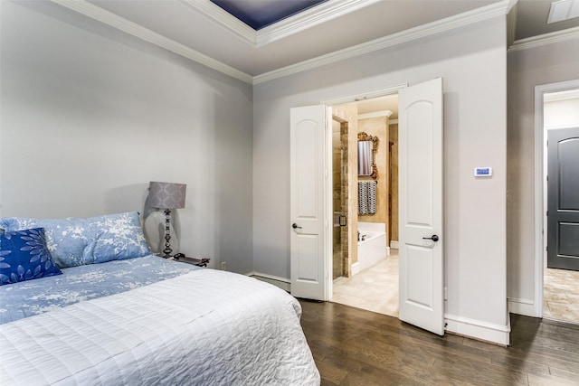 bedroom with crown molding, visible vents, baseboards, and wood finished floors