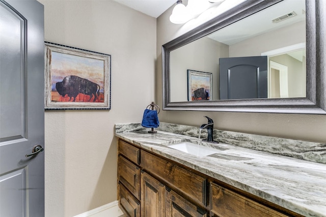 bathroom featuring visible vents and vanity