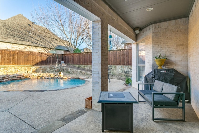 view of patio / terrace featuring a fenced backyard and a fenced in pool