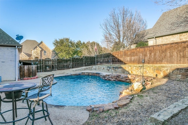 view of pool featuring a fenced in pool, a patio area, and a fenced backyard