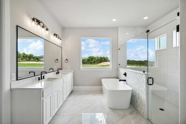 1027 Estancia Blvd, Weatherford, TX 76088 - full bathroom with a freestanding tub, a sink, double vanity, and a stall shower