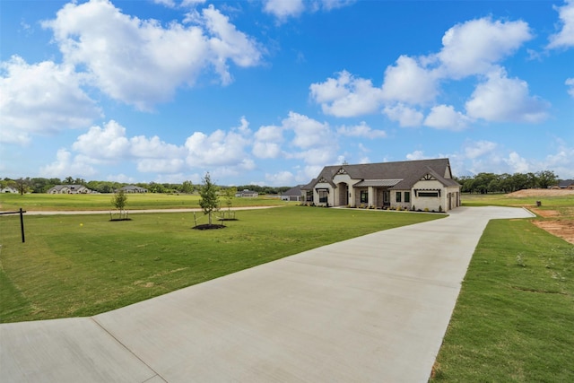 1027 Estancia Blvd, Weatherford, TX 76088 - view of front of property featuring a garage, driveway, stone siding, and a front yard