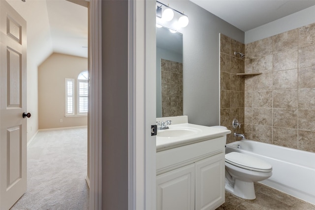 full bathroom featuring tiled shower / bath, vanity, toilet, and lofted ceiling