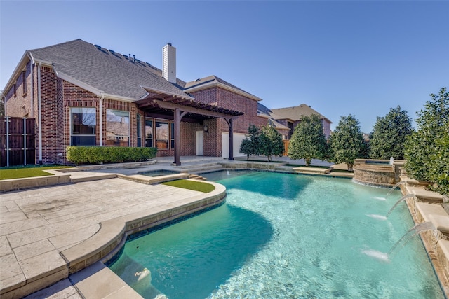 view of swimming pool with an in ground hot tub, pool water feature, a pergola, and a patio