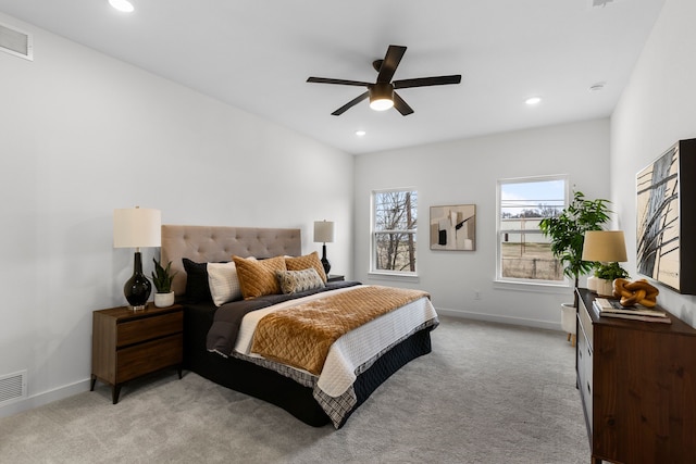 bedroom featuring light carpet and ceiling fan