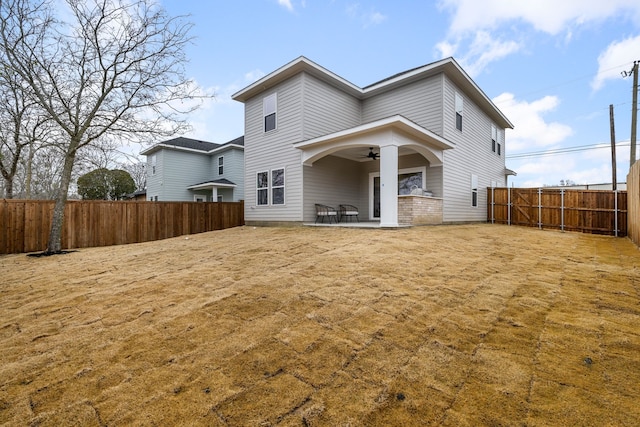 rear view of house with a patio area and ceiling fan