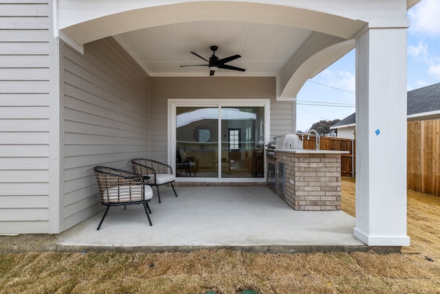 view of patio / terrace featuring area for grilling and ceiling fan