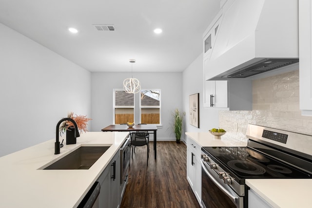 kitchen with electric stove, sink, white cabinetry, hanging light fixtures, and custom exhaust hood