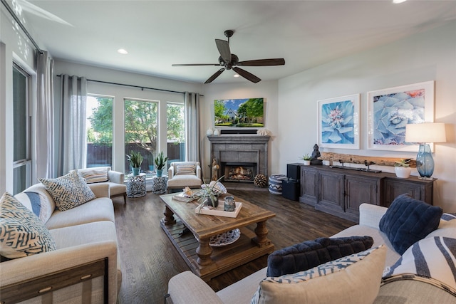 living room featuring dark hardwood / wood-style floors and ceiling fan