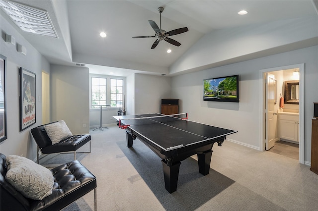 rec room with vaulted ceiling, light colored carpet, and ceiling fan