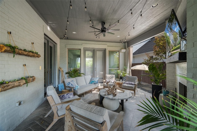 view of patio featuring ceiling fan and outdoor lounge area