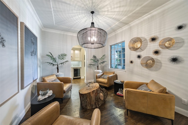 interior space with an inviting chandelier, ornamental molding, and dark hardwood / wood-style flooring