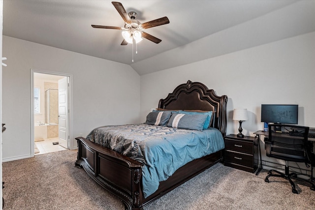 carpeted bedroom with vaulted ceiling, connected bathroom, and ceiling fan