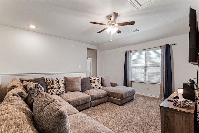 living room featuring vaulted ceiling, carpet floors, and ceiling fan