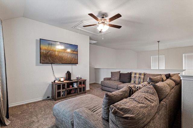 living room featuring lofted ceiling and carpet