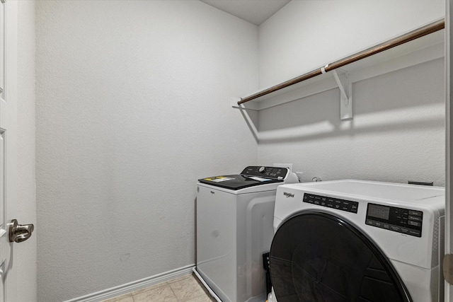 washroom with washing machine and clothes dryer