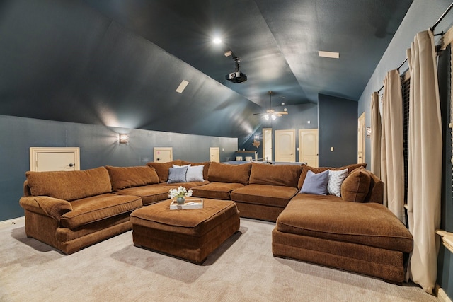 carpeted cinema featuring vaulted ceiling