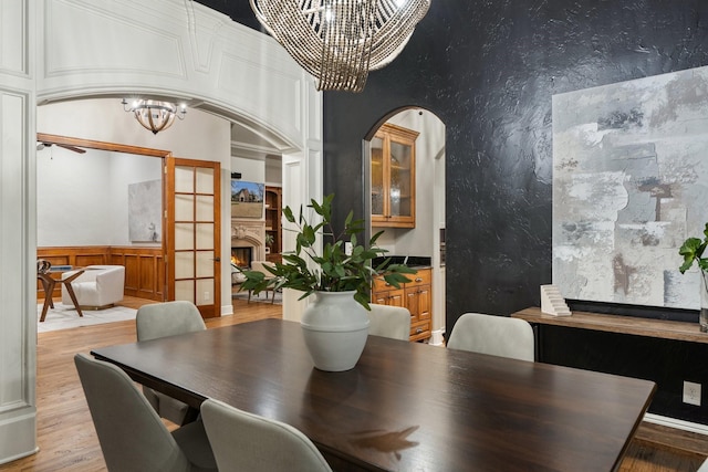 dining space featuring a notable chandelier and light hardwood / wood-style floors