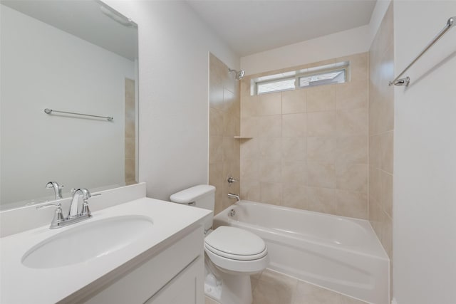 full bathroom with vanity, tile patterned flooring, toilet, and tiled shower / bath